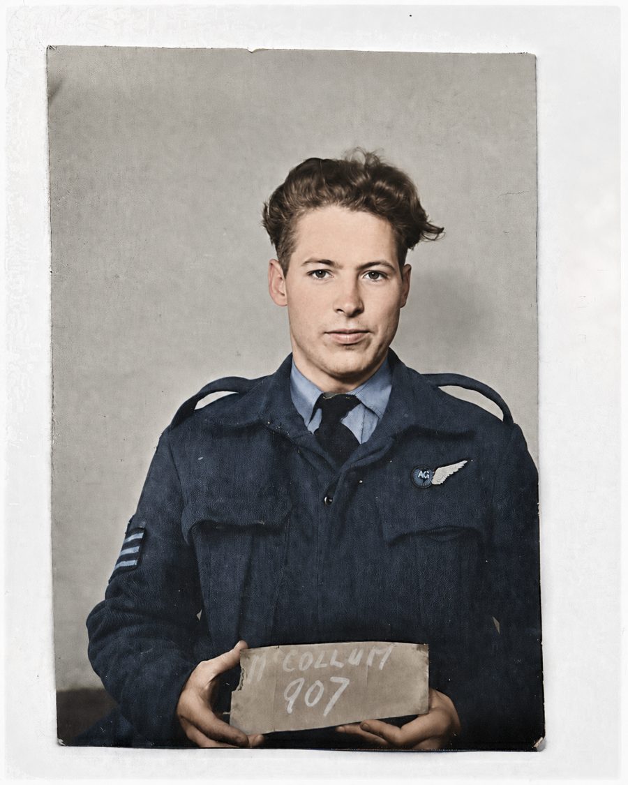 William John McCollum in RCAF battledress, air gunner's half-wing on his chest, holding a slate reading McCollum 907